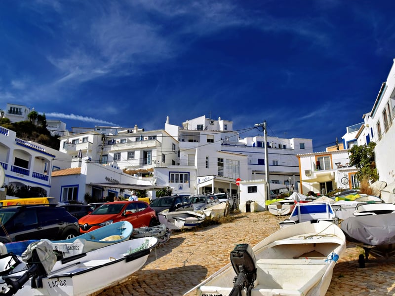Traditional fishing boats on the beach in Algarve village