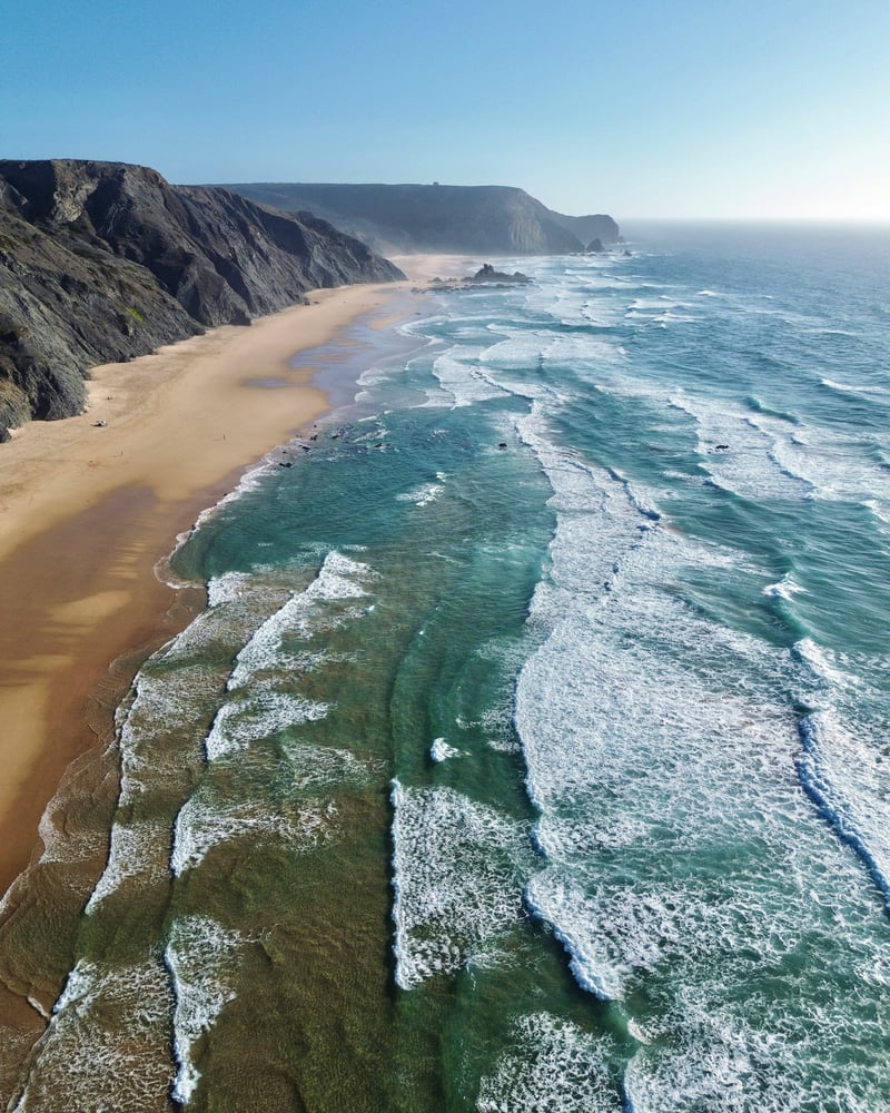 Aerial view of sandy beach and cliffs on Rota Vicentina Fisherman's Trail Portugal