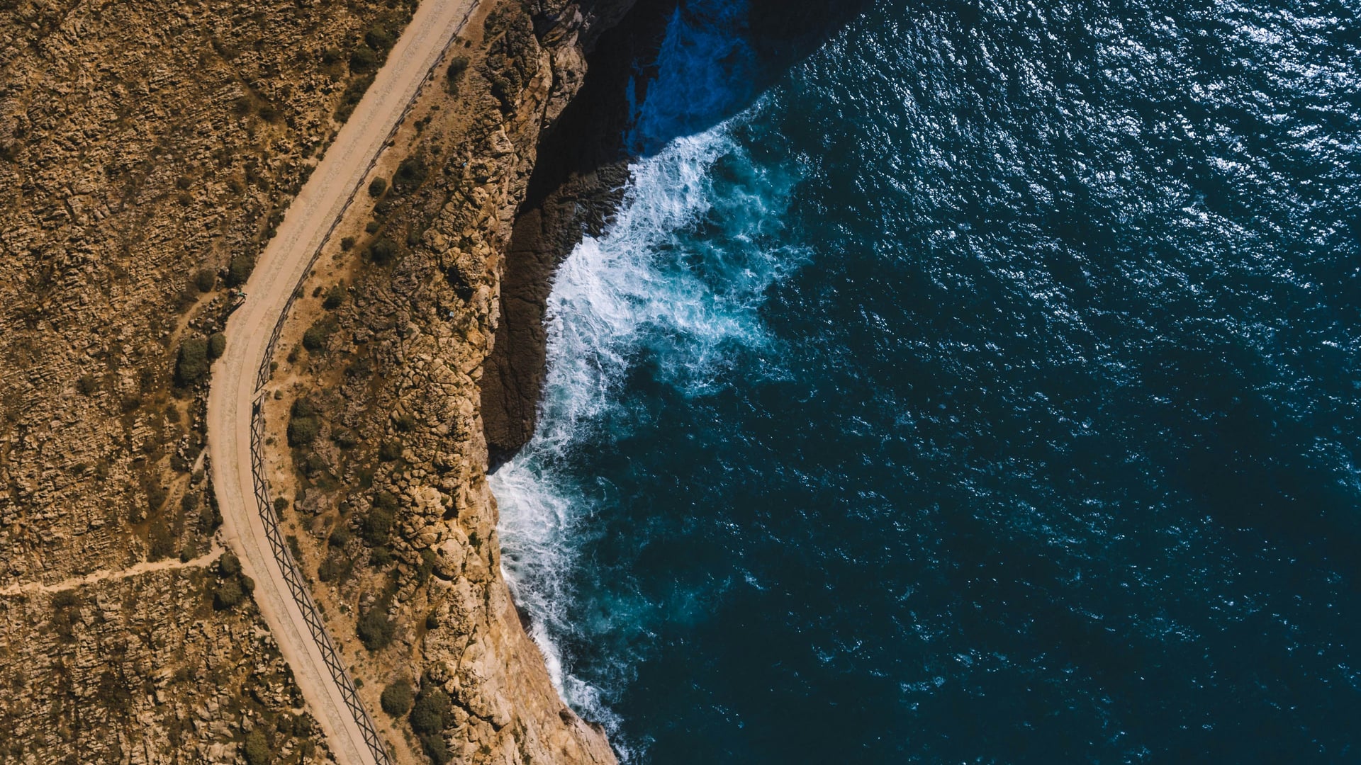 Aerial view of Fisherman's Trail winding along the dramatic coastline