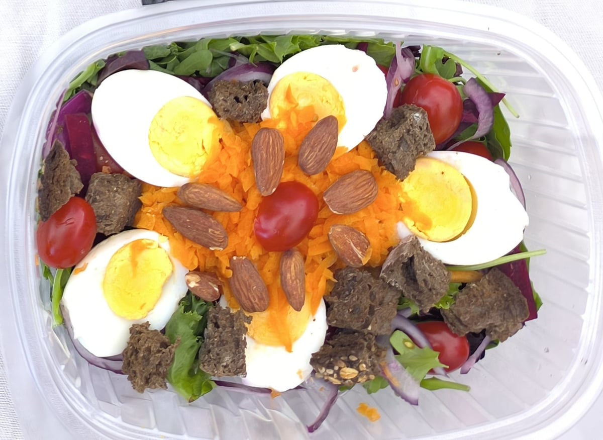 Traking Transfers Vegetarian Salad: boiled egg, cherry tomatoes, grated carrot and seeded-bread croutons on mixed greens
