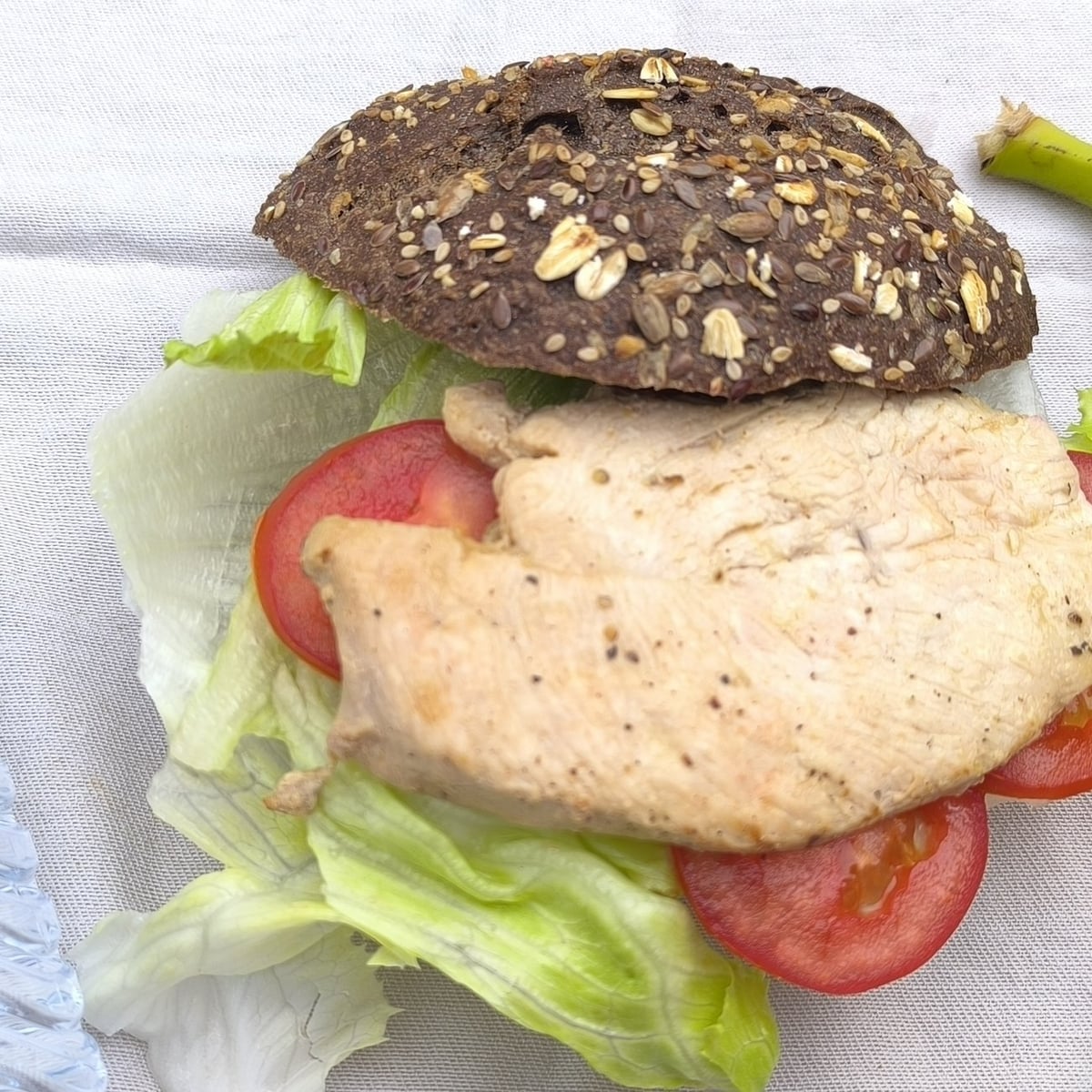 Traking Transfers Chicken Sandwich: grilled chicken, lettuce and tomato on dark seeded bread