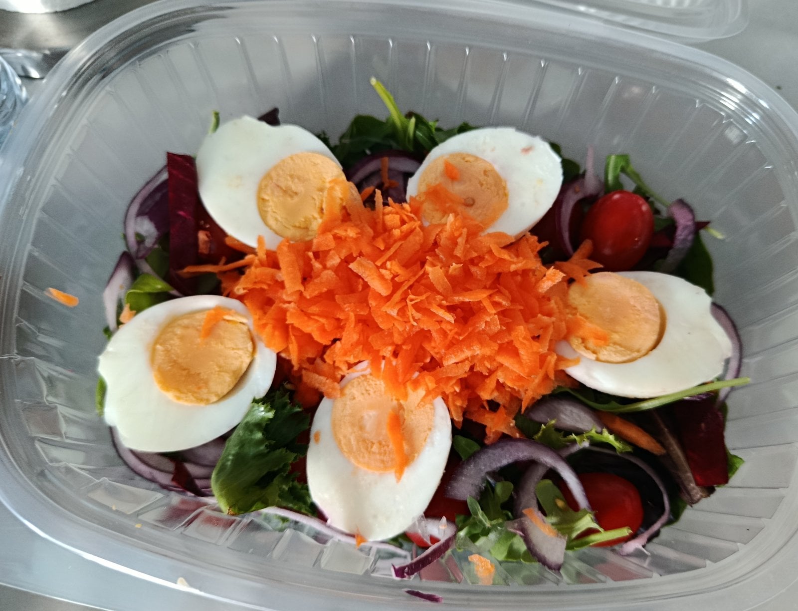 Traking Transfers Vegetarian Salad with boiled egg, grated carrot and red onion